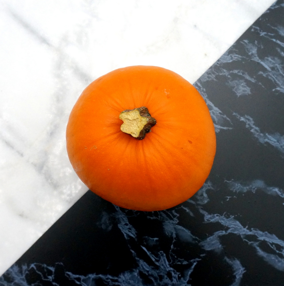 Pumpkin on a marble tile