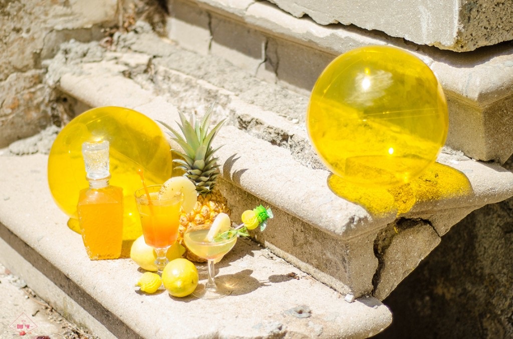 Yellow pool toys add color to this tropical drink vignette
