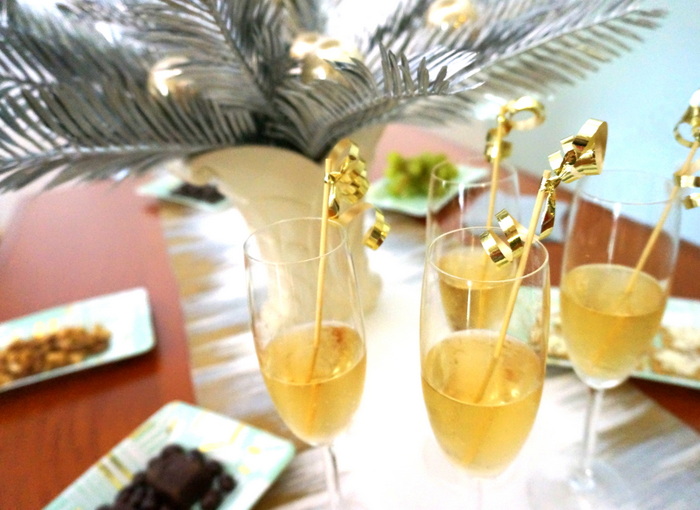 Champagne with party stirrers