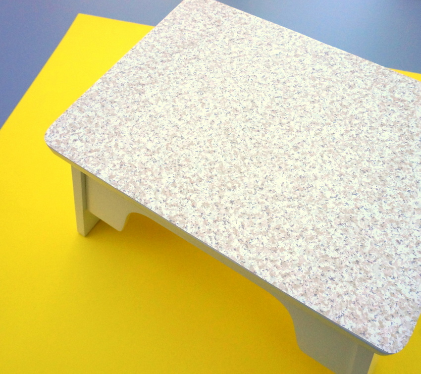 Stepping stool with contact paper top