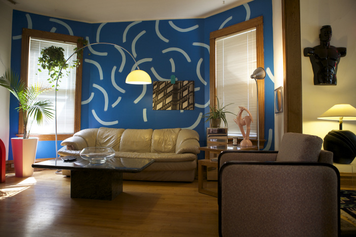A David Hockney-inspired wall in a Memphis-style living room