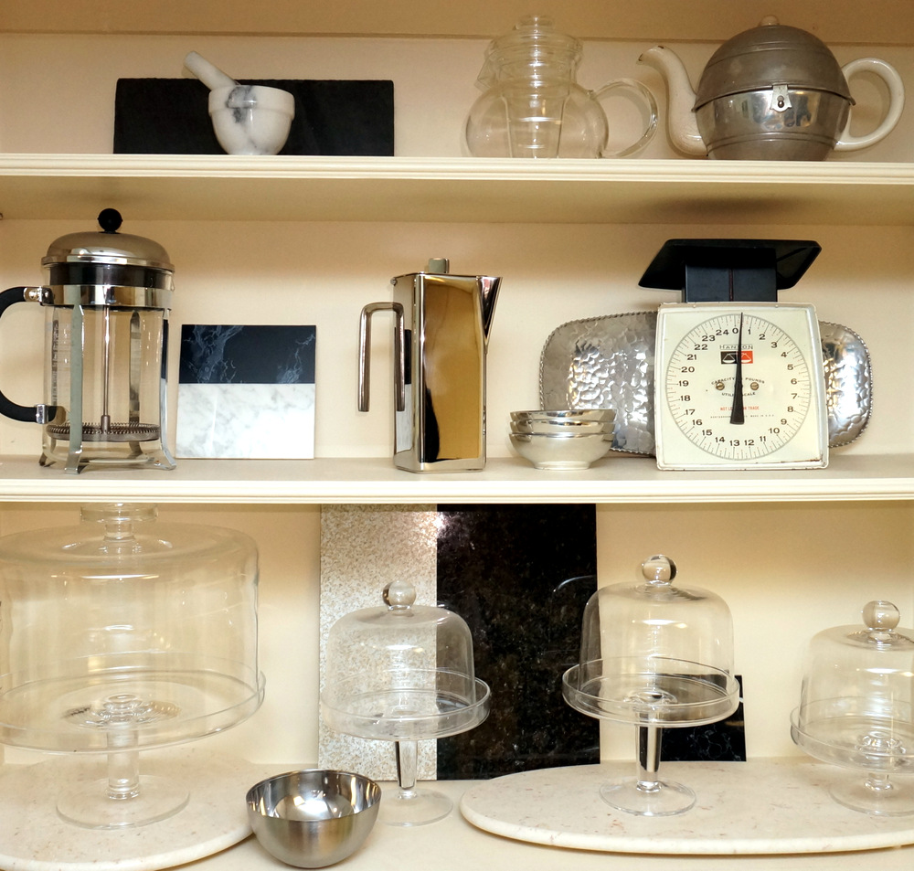 Glass and chrome on open kitchen shelving