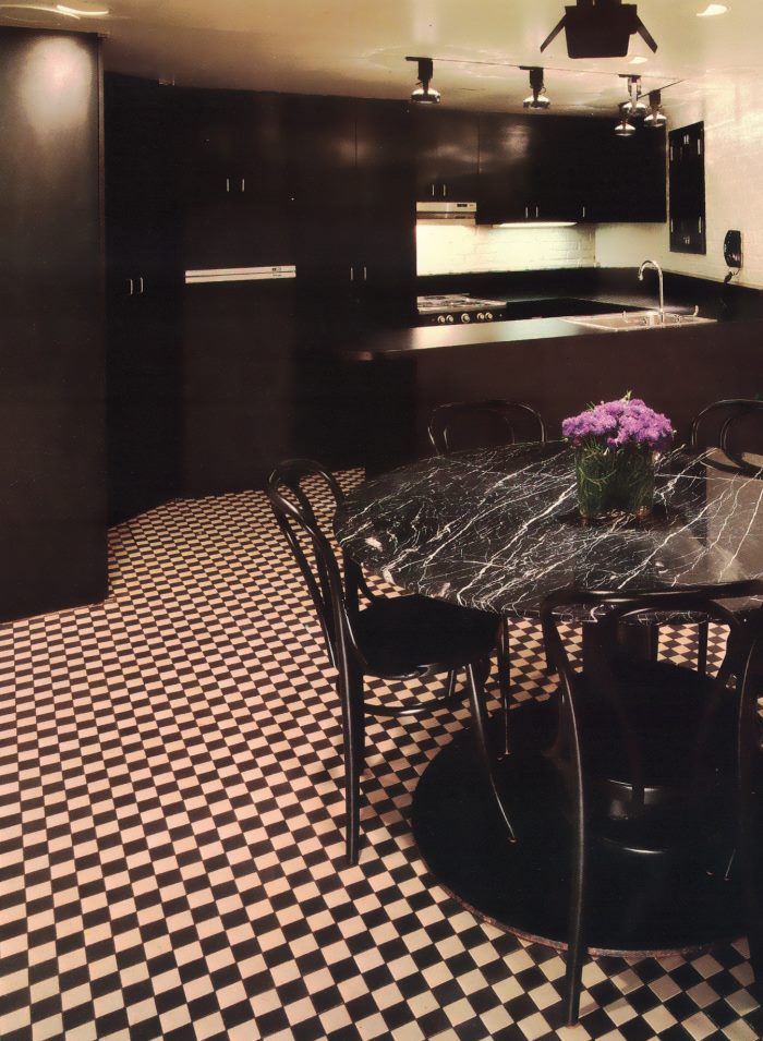 Modern kitchen with a black and white tiled floor