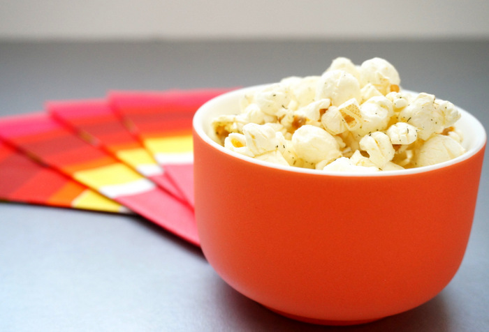 Popcorn in an orange bowl