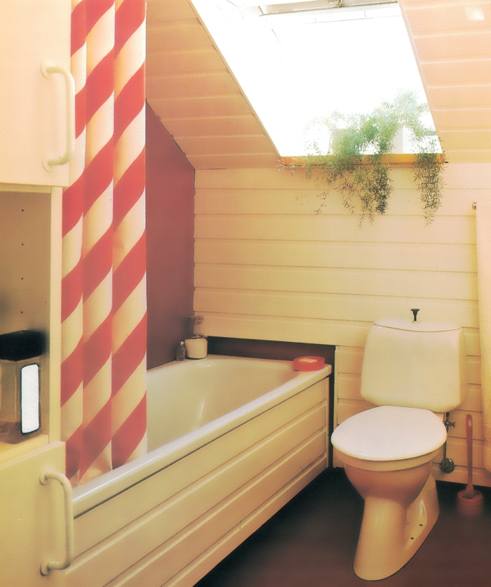 '80s bathroom with a striped shower curtain