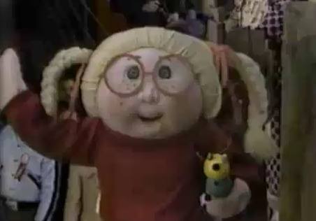 A Cabbage Patch Kid waves at the Macy's Thanksgiving Day Parade